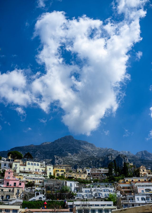 Mountain with similar shaped cloud mirrored