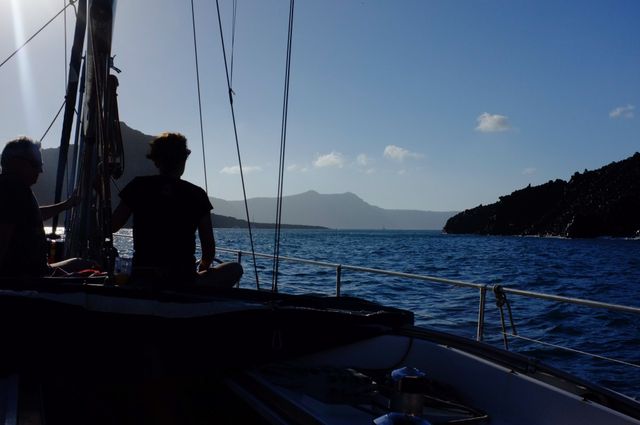 person looks at sea from a sailboat